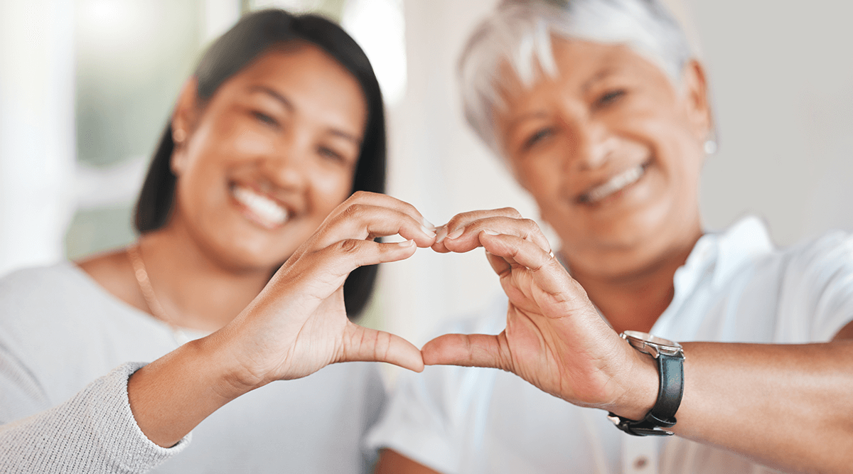 Mother and Daughter Relationship with heart hand symbol